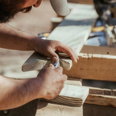 Carpenter working on custom woodwork for home renovation